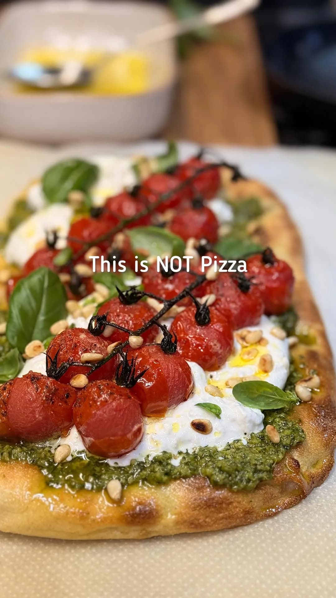 Pinsa with Burrata, Roasted Cherry Tomatoes, and Pesto